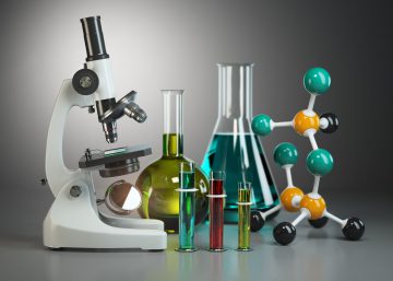 Microscope with flasks, vials and model of molecule. Chemistry o